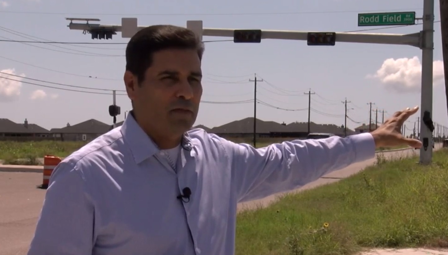 Gil Hernandez discussing a neighborhood infrastructure project near Rodd Field Road